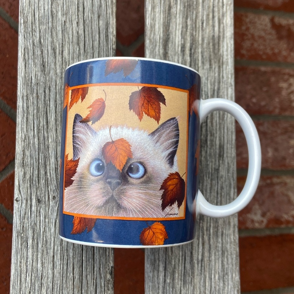 Lang and wise cat leaves mug